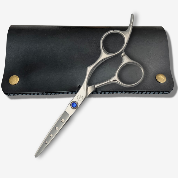 5.5 or 6.0 inch lightweight hair shears Quadra on studio grey background